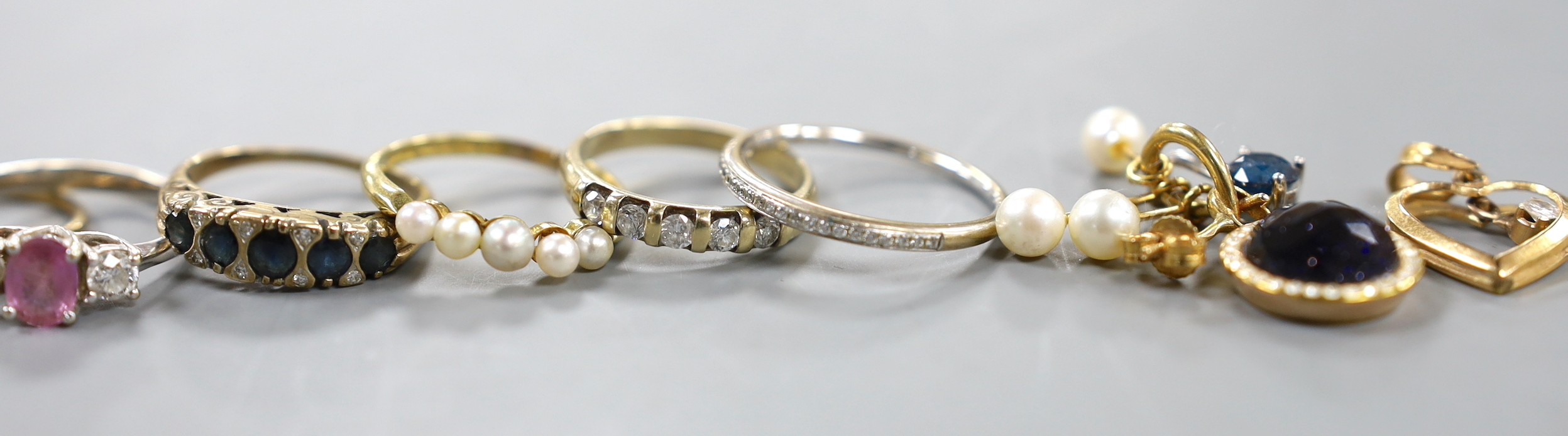A modern platinum and solitaire diamond set ring, size G, gross weight 1.4 grams, four assorted 18ct gold and gem set rings including diamond chip half eternity and a pair of Italian 750 and cultured pearl earrings, gros